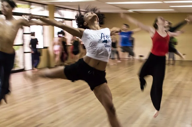 An adult dance class mid-session in Brighton